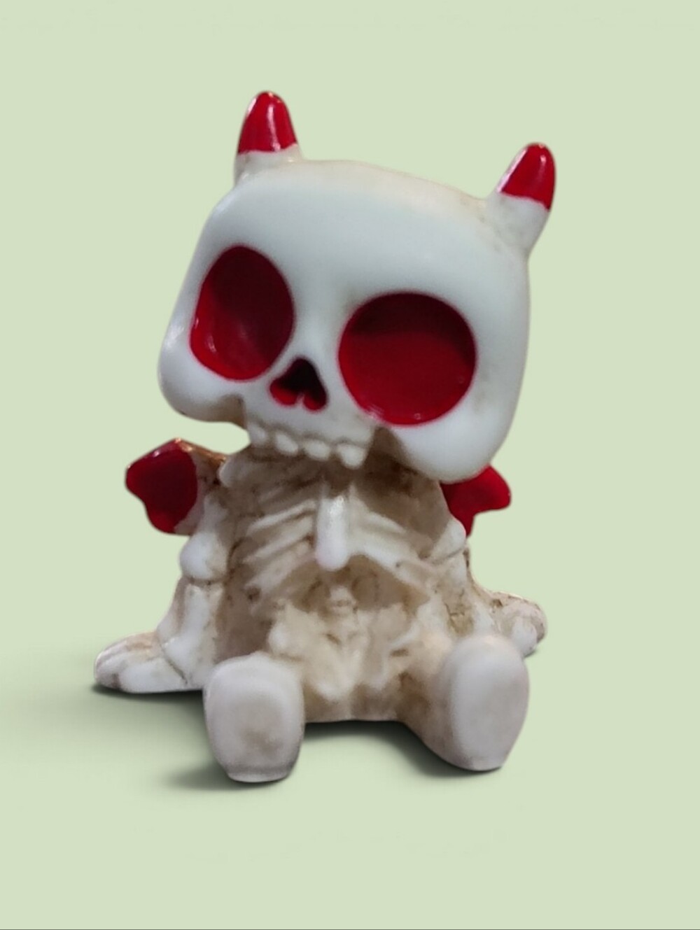 White and Red Devil Skull Figurine Home Accent